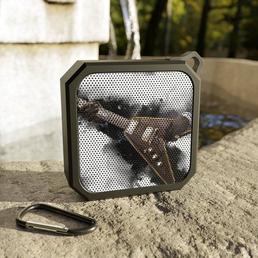 digital painting of a vintage brown electric guitar with hands printed on a bluetooth speaker