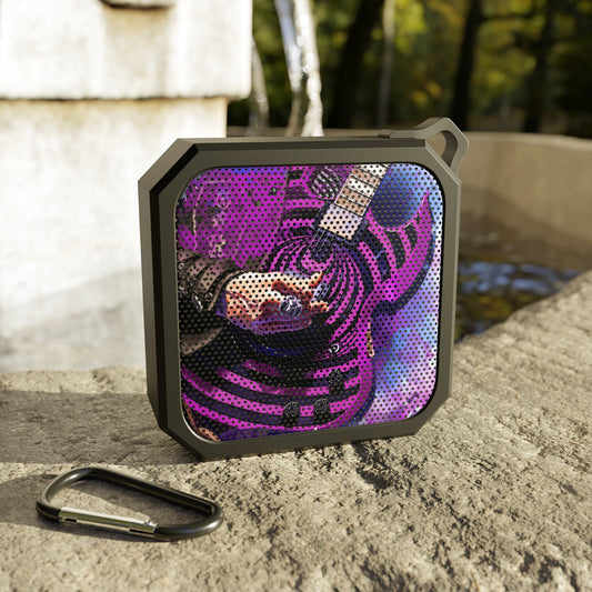 digital painting of a purple black electric guitar with hand printed on a bluetooth speaker