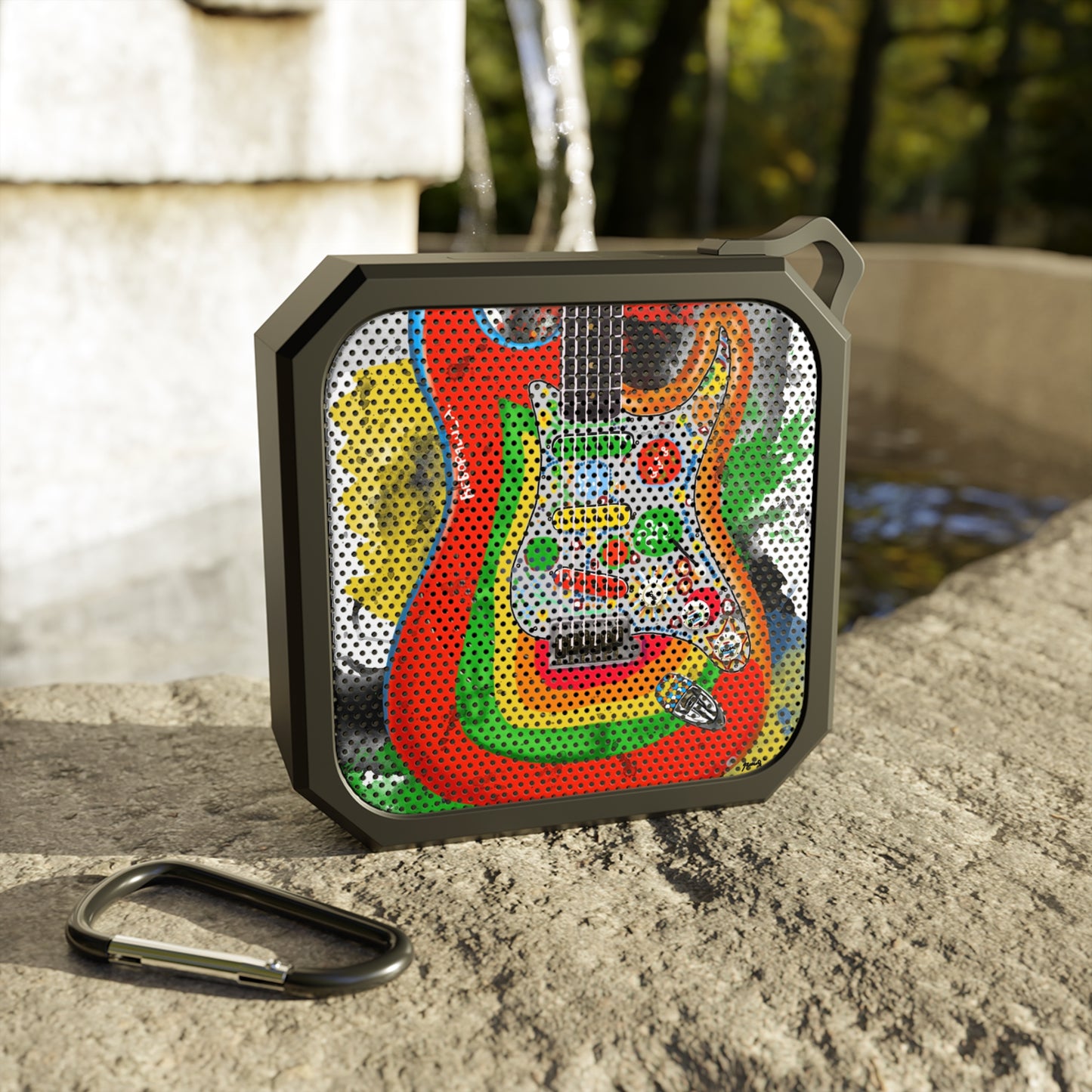 digital painting of a rainbow colored electric guitar printed on a bluetooth speaker
