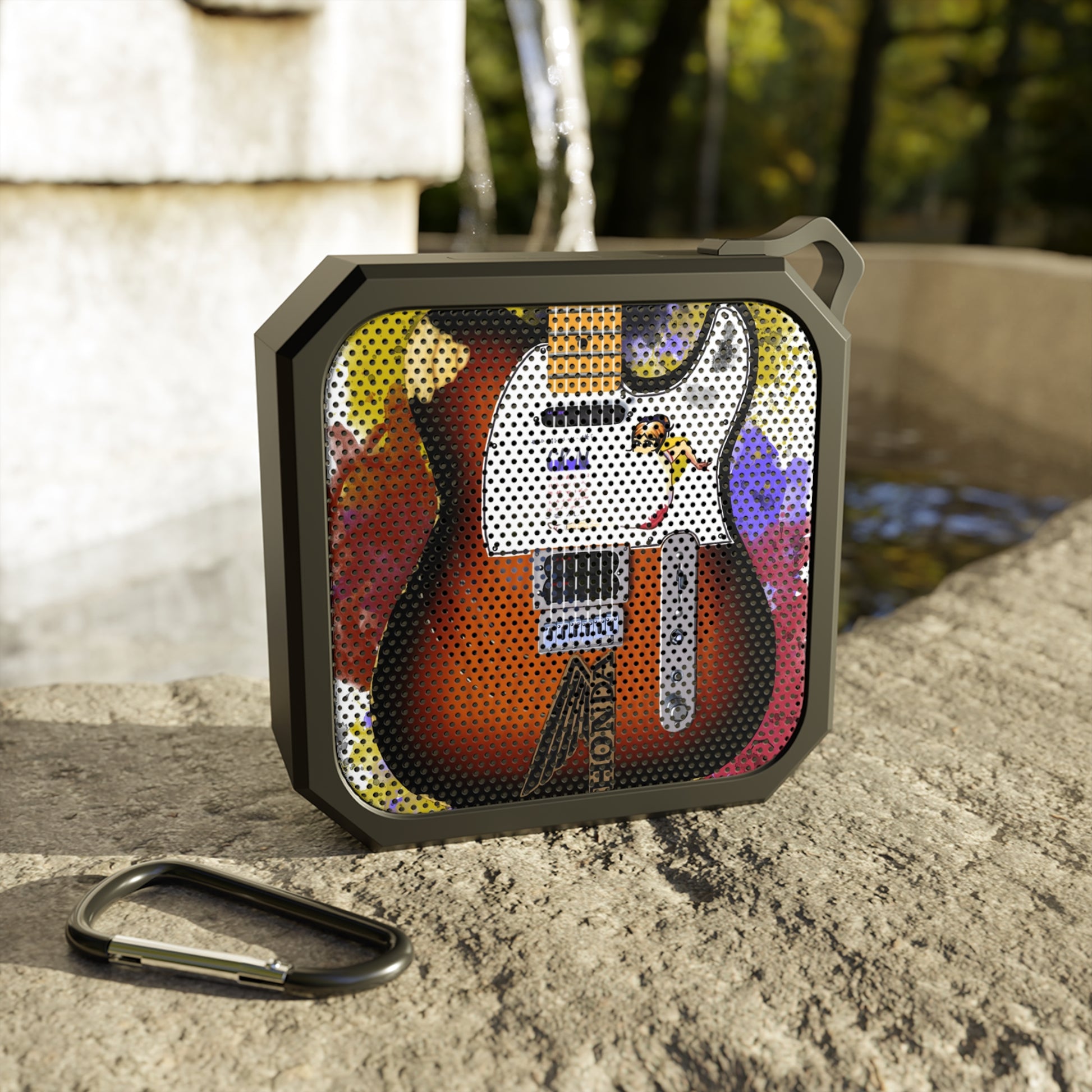 digital painting of a sunburst electric guitar with stickers printed on a bluetooth speakaer